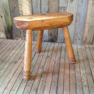 Rustic three-legged stool
